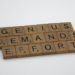 scrabble tiles on a white surface